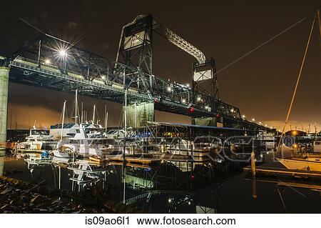 Stock Image - "Port gantry at night, Puget Sound, Tacoma, Washington State, USA". Fotosearch