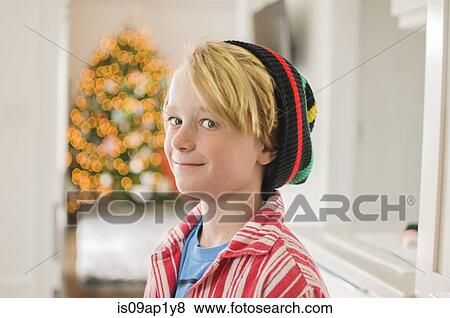 Portrait of boy wearing knit hat looking sideways View Large Photo Image Stock Photo - Portrait of boy wearing knit hat looking sideways. Fotosearch