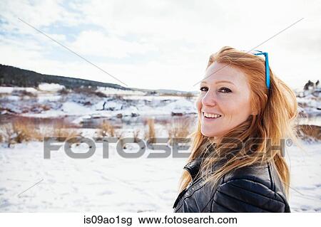 Portrait of mid adult woman in snow covered landscape View Large Photo Image Stock Image - Portrait of mid adult woman in snow covered landscape. Fotosearch