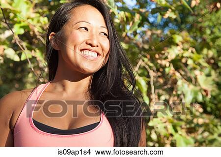 "Portrait of mid adult woman, wearing sports vest, outdoors" View Large Photo Image Picture - "Portrait of mid adult woman, wearing sports vest, outdoors". Fotosearch