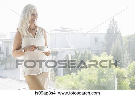 Portrait of senior woman with cup of tea View Large Photo Image Picture - Portrait of senior woman with cup of tea. Fotosearch