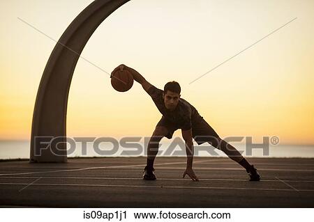 "Portrait of young man, exercising with basketball, outdoors" View Large Photo Image Stock Image - "Portrait of young man, exercising with basketball, outdoors". Fotosearch