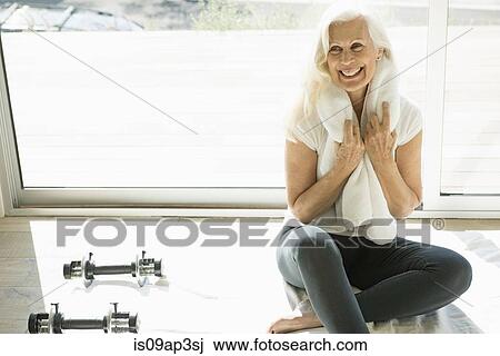Senior woman ready for exercise with towel and weights View Large Photo Image Stock Image - Senior woman ready for exercise with towel and weights. Fotosearch