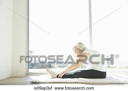 Senior woman stretching View Large Photo Image Stock Image - Senior woman stretching. Fotosearch