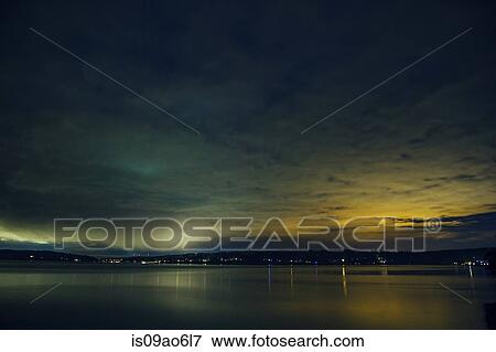 Stock Photo - "Silhouetted view of Puget Sound at night, Seattle, Washington State, USA". Fotosearch