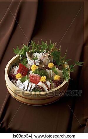 Stock Image - Sliced raw fish in bowl. Fotosearch