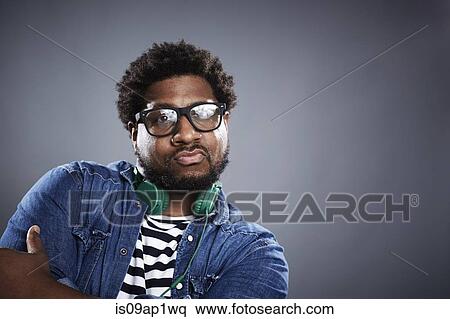Studio portrait mid adult man posing with headphones View Large Photo Image Stock Photography - Studio portrait mid adult man posing with headphones. Fotosearch