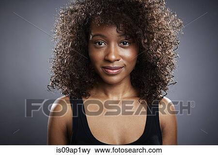 Stock Photo - Studio portrait of beautiful young woman. Fotosearch