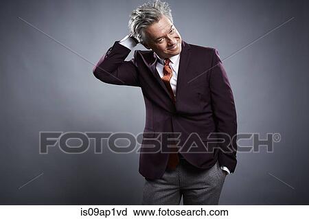 Studio portrait of mature businessman scratching his head View Large Photo Image Stock Image - Studio portrait of mature businessman scratching his head. Fotosearch