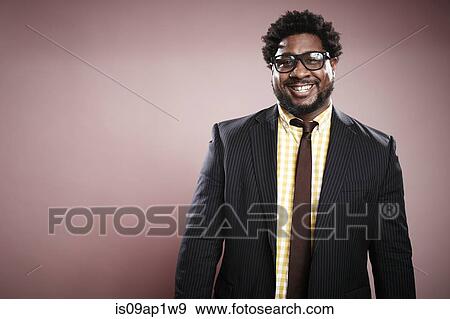 Studio portrait of smiling mid adult businessman View Large Photo Image Stock Photo - Studio portrait of smiling mid adult businessman. Fotosearch