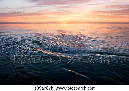 Stock Image - "Sunset over sea, Encinitas, California, USA". Fotosearch