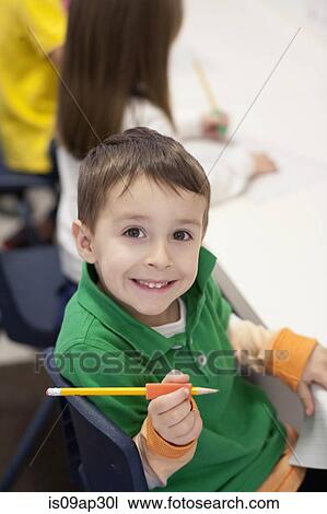 Toddler writing in classroom View Large Photo Image Stock Image - Toddler writing in classroom. Fotosearch