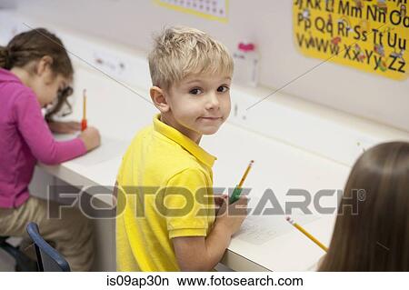 Toddlers writing in classroom View Large Photo Image Picture - Toddlers writing in classroom. Fotosearch