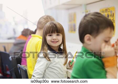 Toddlers writing in classroom View Large Photo Image Picture - Toddlers writing in classroom. Fotosearch