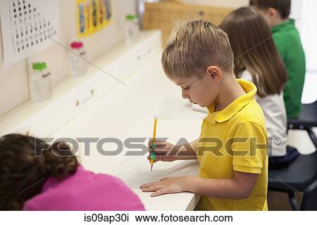 Toddlers writing in classroom View Large Photo Image Stock Image - Toddlers writing in classroom. Fotosearch