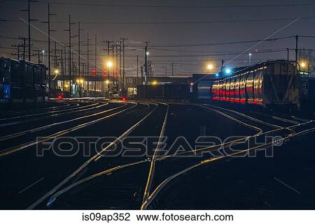 "Train tracks at night, Seattle, USA" View Large Photo Image Stock Image - "Train tracks at night, Seattle, USA". Fotosearch