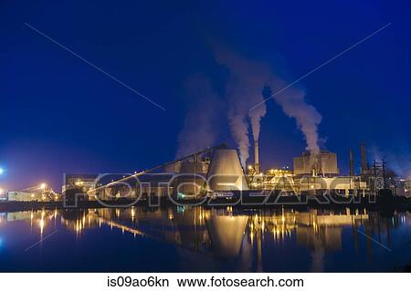 Picture - "View of pulp mill on waterfront at night, Strait of Juan de Fuca, Port Angeles, Washington State, USA". Fotosearch