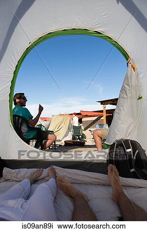 "Young adult friends in and outside tent, Anza-Borrego Desert State Park, California, USA" View Large Photo Image Stock Image - "Young adult friends in and outside tent, Anza-Borrego Desert State Park, California, USA". Fotosearch