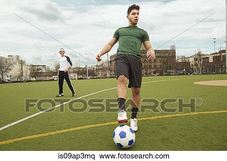 Stock Photography - Young male soccer player preparing to take a corner shot. Fotosearch