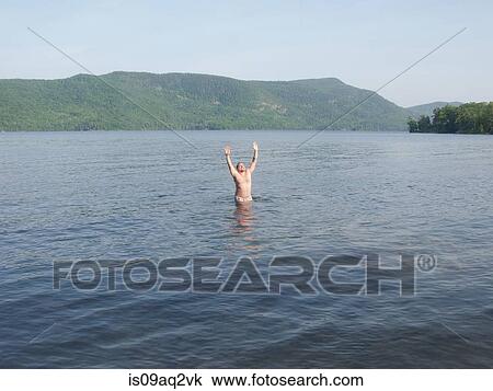 "A man celebrating summer in Lake George, New York, USA" View Large Photo Image Stock Image - "A man celebrating summer in Lake George, New York, USA". Fotosearch