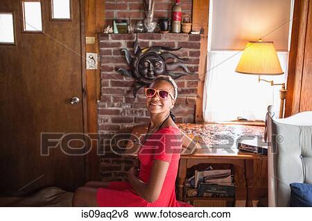 A young teenage girl doing a puzzle on summer vacation View Large Photo Image Stock Photo - A young teenage girl doing a puzzle on summer vacation. Fotosearch