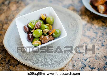 Bowl of black and green olives on restaurant table View Large Photo Image Picture - Bowl of black and green olives on restaurant table. Fotosearch