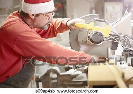 Cabinet maker using circular saw in workshop View Large Photo Image Stock Image - Cabinet maker using circular saw in workshop. Fotosearch