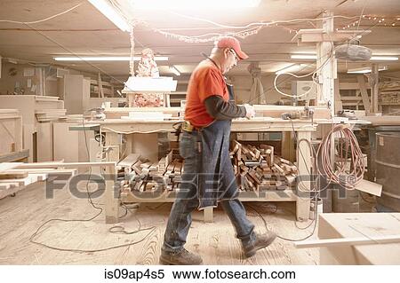 Cabinet maker walking across workshop View Large Photo Image Stock Photography - Cabinet maker walking across workshop. Fotosearch