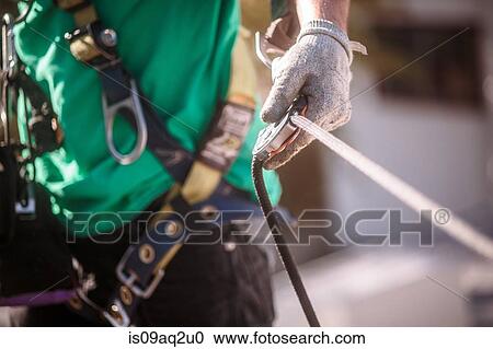 Close up of solar panel installation crew member with harness View Large Photo Image Stock Image - Close up of solar panel installation crew member with harness. Fotosearch
