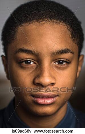 Close up portrait of serious teenage boy View Large Photo Image Stock Photo - Close up portrait of serious teenage boy. Fotosearch