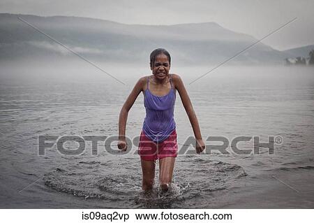 "Cold girl getting out of water on summer vacation at Lake George, New York, USA" View Large Photo Image Stock Photography - "Cold girl getting out of water on summer vacation at Lake George, New York, USA". Fotosearch