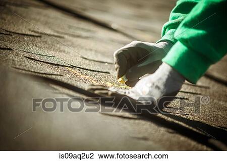 Construction crew member preparing roof for solar panel installation View Large Photo Image Stock Image - Construction crew member preparing roof for solar panel installation. Fotosearch