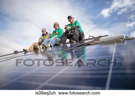 Construction crew taking break from installing solar panels on a house View Large Photo Image Stock Image - Construction crew taking break from installing solar panels on a house. Fotosearch