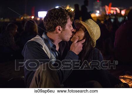 Stock Photograph - "Couple kissing, Santa Monica Pier, Santa Monica Beach, US". Fotosearch