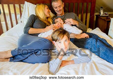 Couple with son and newborn twin girl and boy View Large Photo Image Stock Photography - Couple with son and newborn twin girl and boy. Fotosearch