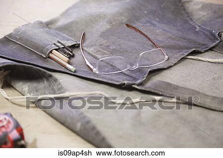 Dusty apron and eye glasses in cabinet makers workshop View Large Photo Image Stock Image - Dusty apron and eye glasses in cabinet makers workshop. Fotosearch