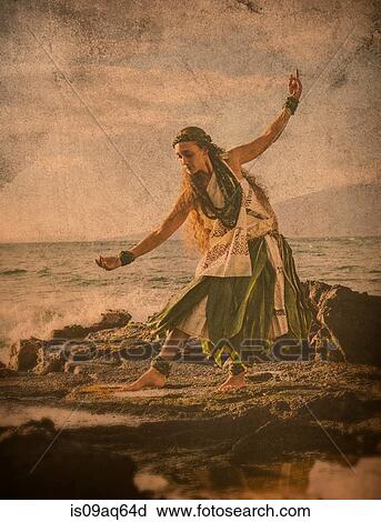 "Enhanced image of woman hula dancing on coastal rocks wearing traditional costume, Maui, Hawaii, USA" View Large Photo Image Stock Image - "Enhanced image of woman hula dancing on coastal rocks wearing traditional costume, Maui, Hawaii, USA". Fotosearch