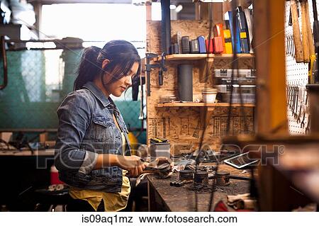 Female mechanic in workshop View Large Photo Image Stock Photo - Female mechanic in workshop. Fotosearch