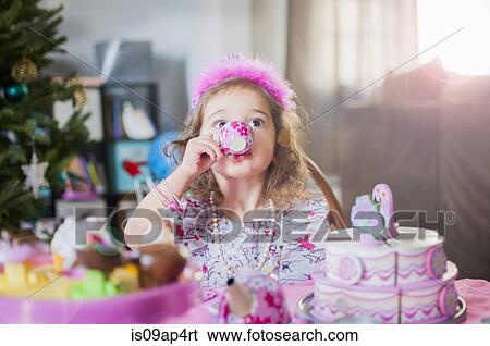 Female toddler drinking from teacup at birthday party View Large Photo Image Stock Photograph - Female toddler drinking from teacup at birthday party. Fotosearch