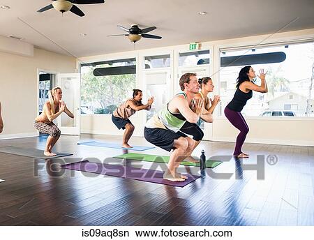 Picture - Five people in yoga class. Fotosearch
