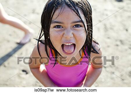 Girl playing on beach View Large Photo Image Stock Photo - Girl playing on beach. Fotosearch