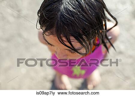 Girl playing on beach View Large Photo Image Stock Photo - Girl playing on beach. Fotosearch