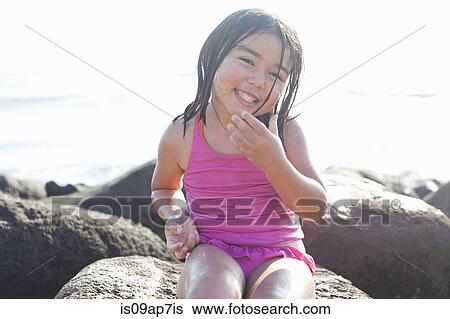 Girl playing on beach View Large Photo Image Stock Photograph - Girl playing on beach. Fotosearch