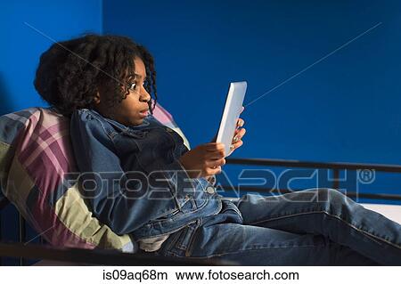 Girl posing for digital tablet selfie on bunkbed View Large Photo Image Picture - Girl posing for digital tablet selfie on bunkbed. Fotosearch