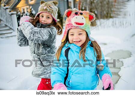 Stock Photo - Girls enjoying winter. Fotosearch
