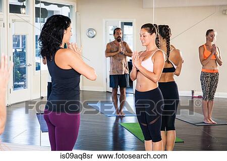 Stock Photography - Group of people in yoga class. Fotosearch