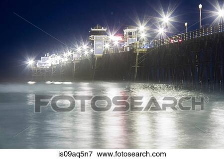 "Illuminated pier, at night, California, USA" View Large Photo Image Stock Photo - "Illuminated pier, at night, California, USA". Fotosearch
