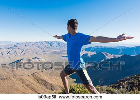 "Male trail runner warming up whilst looking out at landscape on Pacific Crest Trail, Pine Valley, California, USA" View Large Photo Image Stock Photograph - "Male trail runner warming up whilst looking out at landscape on Pacific Crest Trail, Pine Valley, California, USA". Fotosearch