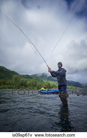 "Man fishing in river, Kodiak, Alaska, USA" View Large Photo Image Stock Photo - "Man fishing in river, Kodiak, Alaska, USA". Fotosearch