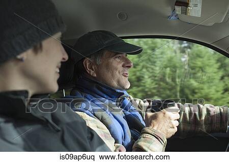 Mature man and daughter driving car View Large Photo Image Stock Photography - Mature man and daughter driving car. Fotosearch